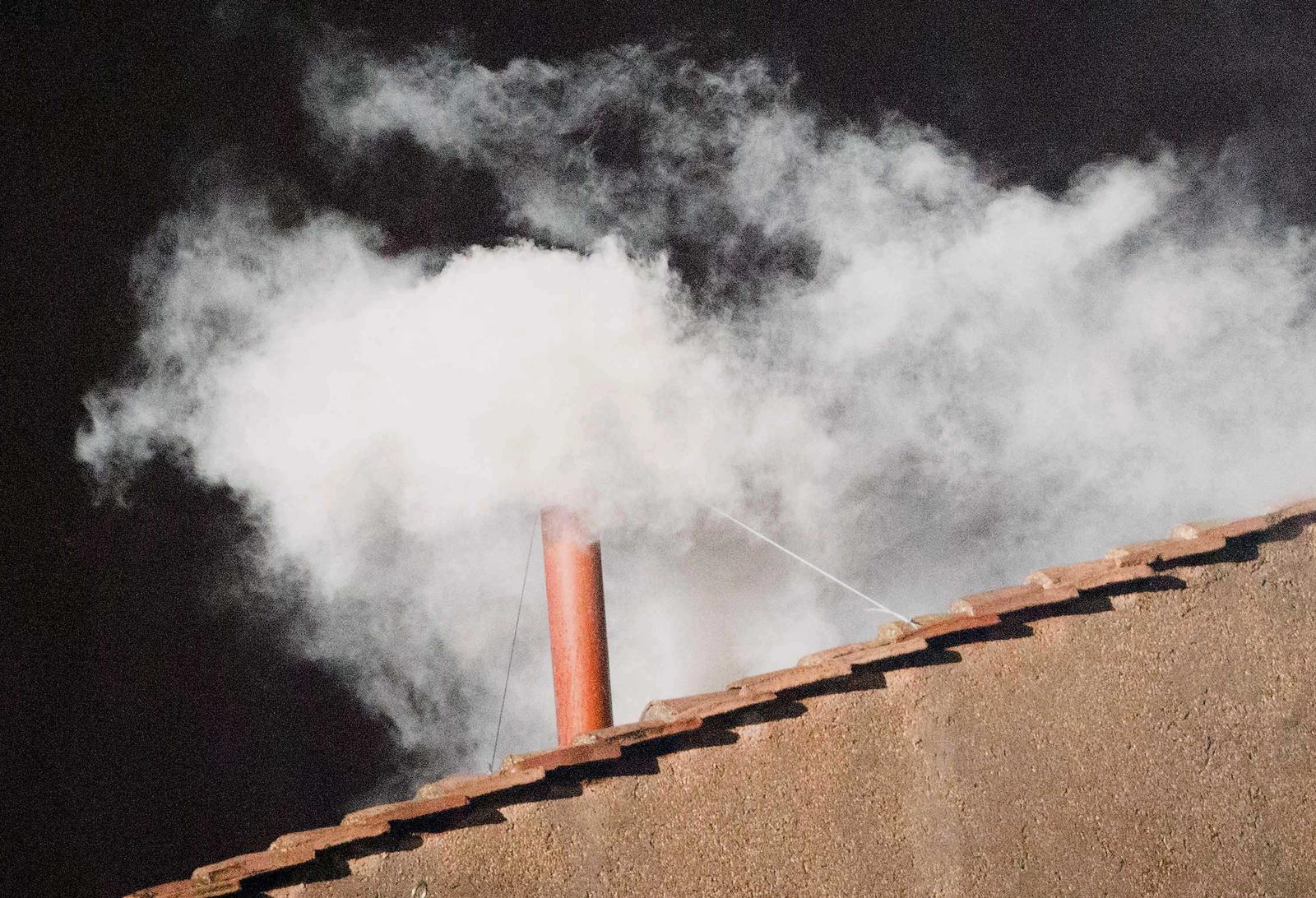 White smoke rises from the chimney of the Sistine Chapel in the Vatican, 13 March 2013. White smoke indicated that a new Pope has been elected. Photo: Michael Kappeler/DPA/PIXSELL