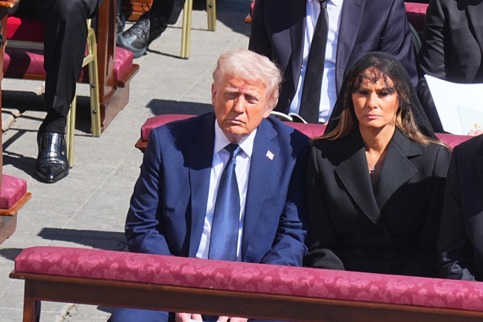 dpatop - 26 April 2025, Vatican, Vatikanstadt: US President Donald Trump and First Lady Melania Trump attend Pope Francis' funeral mass in St. Peter's Square at the Vatican. Photo: Michael Kappeler/dpa Photo: Michael Kappeler/DPA