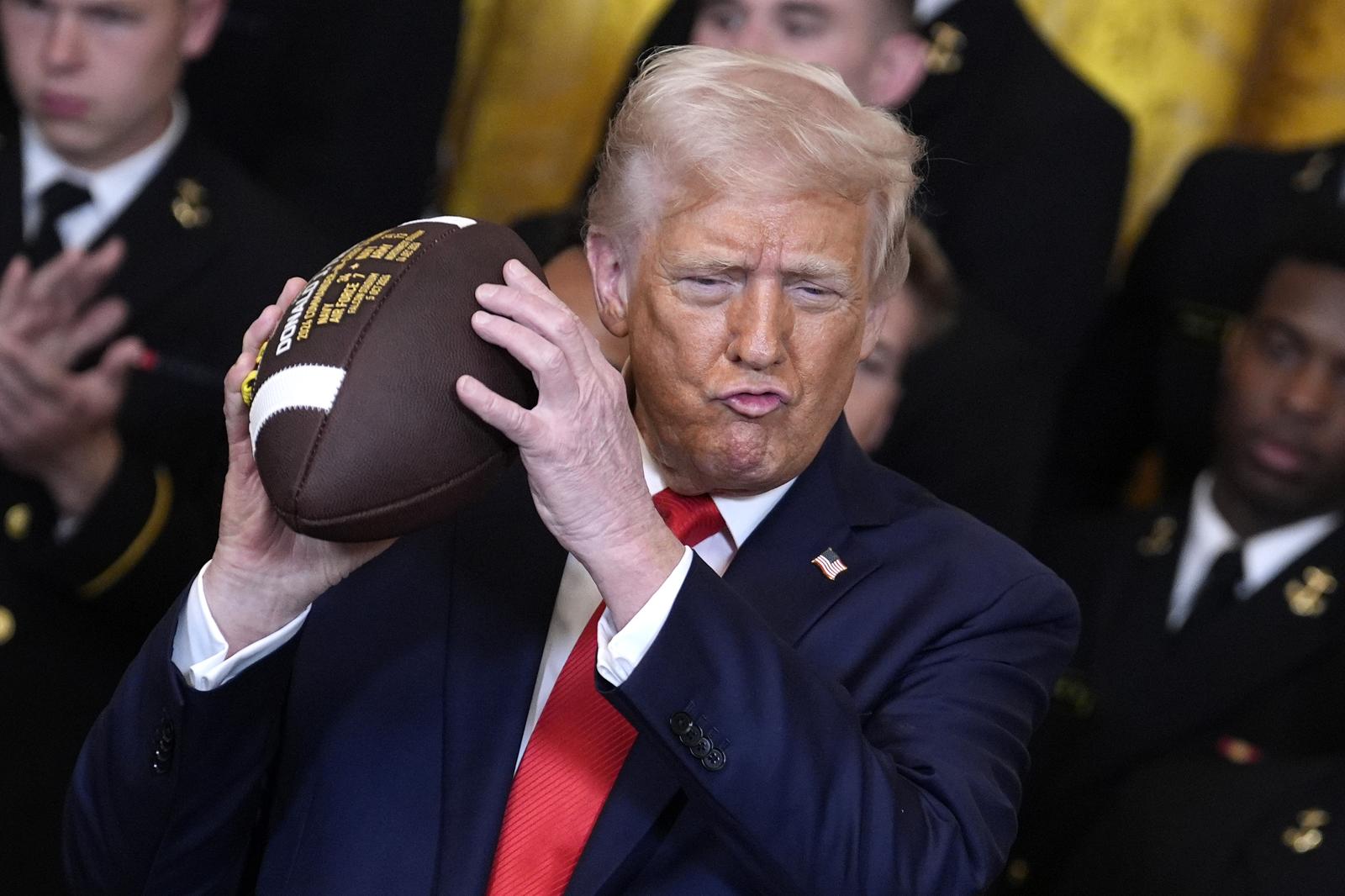 President Donald Trump holds a ceremonial football during the Commander-in-Chief Trophy Presentation to the Navy Midshipmen, the United States Naval Academy, in the East Room at the White House in Washington on Tuesday, April 15, 2025.     Photo by Yuri Gripas/UPI Photo via Newscom Photo: Yuri Gripas/NEWSCOM