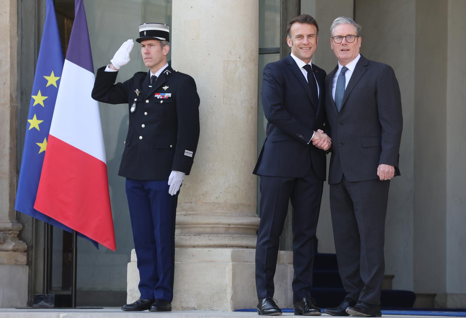 French President Emmanuel Macron greets Britain's Prime Minister Keir Starmer at the Elysee Palace in Paris, France, on Thursday, March 27, 2025. Macron hosted European leaders including President Volodymyr Zelensky for a summit aimed at boosting Ukrainian security ahead of any potential ceasefire with Russia to end the over three-year war. Photo by Maya Vidon-White/UPI Photo via Newscom Photo: MAYA VIDON-WHITE/NEWSCOM