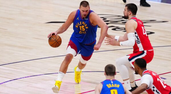 Apr 19, 2025; Denver, Colorado, USA; Denver Nuggets center Nikola Jokic (15) drives at LA Clippers center Ivica Zubac (40) in the second quarter at Ball Arena. Mandatory Credit: Ron Chenoy-Imagn Images Photo: Ron Chenoy/REUTERS