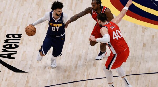 Apr 21, 2025; Denver, Colorado, USA; Denver Nuggets guard Jamal Murray (27) controls the ball as Los Angeles Clippers forward Kawhi Leonard (2) and center Ivica Zubac (40) defend in the fourth quarter during game two of first round for the 2025 NBA Playoffs at Ball Arena. Mandatory Credit: Isaiah J. Downing-Imagn Images Photo: Isaiah J. Downing/REUTERS