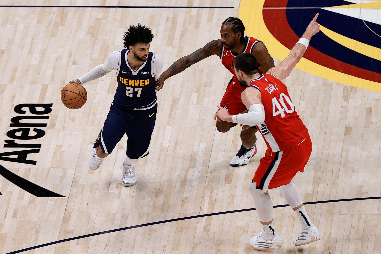 Apr 21, 2025; Denver, Colorado, USA; Denver Nuggets guard Jamal Murray (27) controls the ball as Los Angeles Clippers forward Kawhi Leonard (2) and center Ivica Zubac (40) defend in the fourth quarter during game two of first round for the 2025 NBA Playoffs at Ball Arena. Mandatory Credit: Isaiah J. Downing-Imagn Images Photo: Isaiah J. Downing/REUTERS