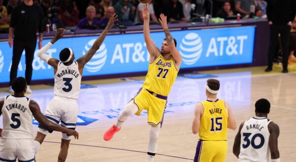 Apr 22, 2025; Los Angeles, California, USA; Los Angeles Lakers guard Luka Doncic (77) shoots the ball over Minnesota Timberwolves forward Jaden McDaniels (3) during the third quarter of game two of first round for the 2024 NBA Playoffs at Crypto.com Arena. Mandatory Credit: Kiyoshi Mio-Imagn Images Photo: Kiyoshi Mio/REUTERS