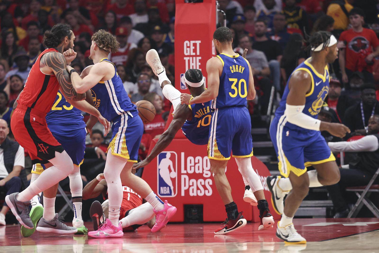 Apr 23, 2025; Houston, Texas, USA; Golden State Warriors forward Jimmy Butler III (10) falls to the floor and suffers an apparent injury during the first quarter during game two of the first round for the 2024 NBA Playoffs against the Houston Rockets at Toyota Center. Mandatory Credit: Troy Taormina-Imagn Images Photo: Troy Taormina/REUTERS