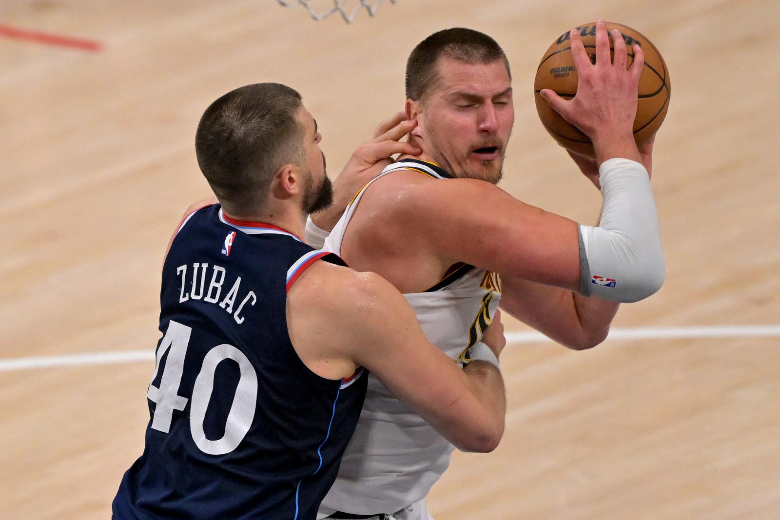Apr 26, 2025; Inglewood, California, USA;  Los Angeles Clippers center Ivica Zubac (40) defends Denver Nuggets center Nikola Jokic (15) in the second half of game four of round one of the 2024 NBA Playoffs at Intuit Dome. Mandatory Credit: Jayne Kamin-Oncea-Imagn Images Photo: Jayne Kamin-Oncea/REUTERS