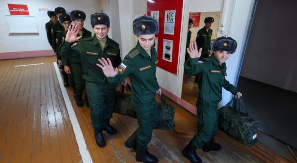 RUSSIA, VLADIVOSTOK - OCTOBER 16, 2024: Conscripts wave as they leave an assembly station of a local draft office before departing for military service with the Russian Army. Yuri Smityuk/TASS/Sipa USA Photo: Tass/SIPA USA