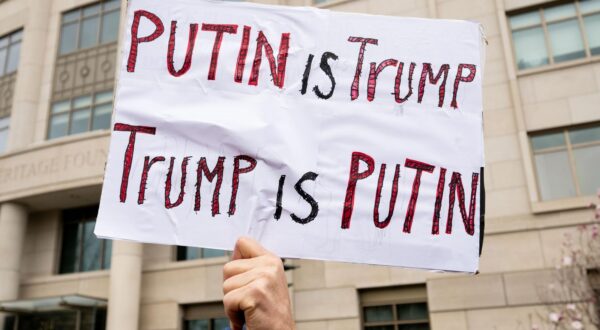 A sign saying "Putin is Trump, Trump is Putin" at a demonstration against the Heritage Foundation, Project 2025, President Trump, and Elon Musk at the Heritage Foundation building in Washington, D.C. (Photo by Michael Brochstein/Sipa USA) Photo: Michael Brochstein/SIPA USA