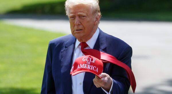 epa12063428 US President Donald Trump walks holding a 'Gulf of America' baseball cap on the South Lawn of the White House before departing to Michigan, in Washington, DC, USA, 29 April 2025. President Trump is due to host a rally in Michigan to mark 100 days since the start of his second term.  EPA/WILL OLIVER
