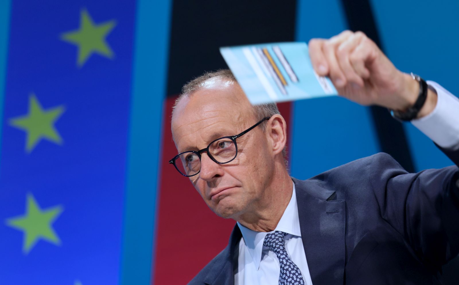 epa12060593 CDU Chairman and faction leader Friedrich Merz votes for the coalition agreement at the meeting of the Federal Committee of the Christian Democratic Union (CDU) in Berlin, Germany, 28 April 2025. The CDU plans to finalize the coalition agreement at a small party convention. Merz is expected to be elected as Chancellor in the Bundestag on 06 May, assuming all goes as planned.  EPA/HANNIBAL HANSCHKE