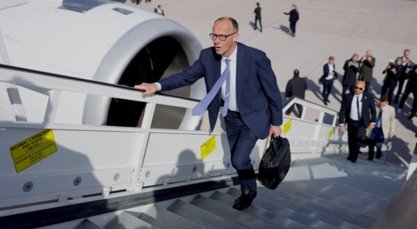 epa12079330 German Chancellor Friedrich Merz boards a plane of German Air Force ’Luftwaffe’ as he departs from the military part of BER airport in Berlin, Germany, 07 May 2025. The German Chancellor visits France and Poland the day after his election.  EPA/HANNIBAL HANSCHKE