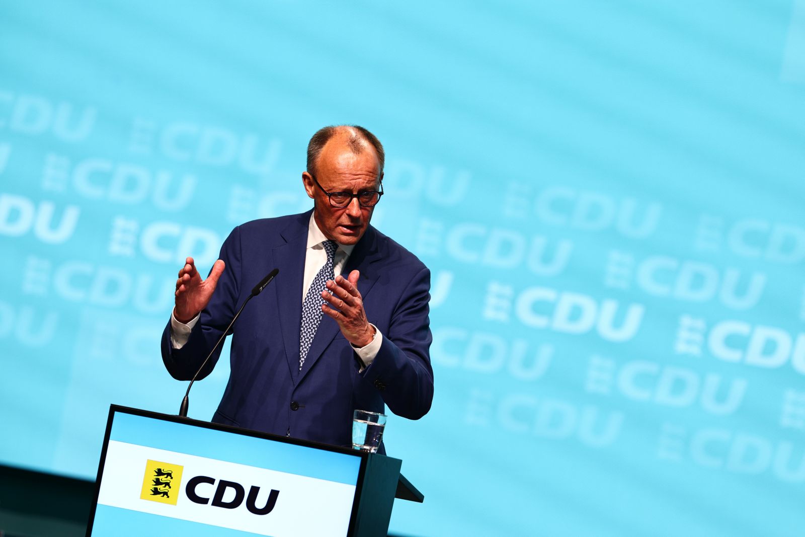 epa12108597 German Chancellor and the Chairman of the Christian Democratic Union (CDU), Friedrich Merz, delivers a speech during a state party conference of the CDU Baden-Wuerttemberg in Stuttgart, Germany, 17 May 2025.  EPA/ANNA SZILAGYI