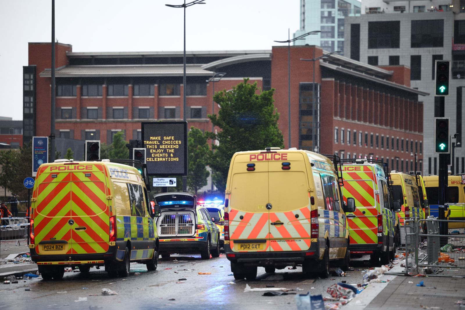 epa12137407 Police vehicles as officers deal with an incident where a car collided with Liverpool supporters during the trophy parade in Liverpool city centre, Britain, 26 May 2025. A man has been detained after the collision with a number of pedestrians during Liverpool FC’s victory parade, Merseyside Police said.  EPA/ADAM VAUGHAN
