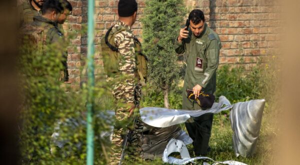 Indian forces look at a part of an unknown aircraft crushed in Wuyan near Indian-administered Kashmir's main city of Srinagar. India fired missiles at Pakistani territory early on May 7, killing at least eight people, according to Pakistan, which said it had begun retaliating in a major escalation between the nuclear-armed rivals. (Photo by Faisal Bashir / SOPA Images/Sipa USA) Photo: SOPA Images/SIPA USA