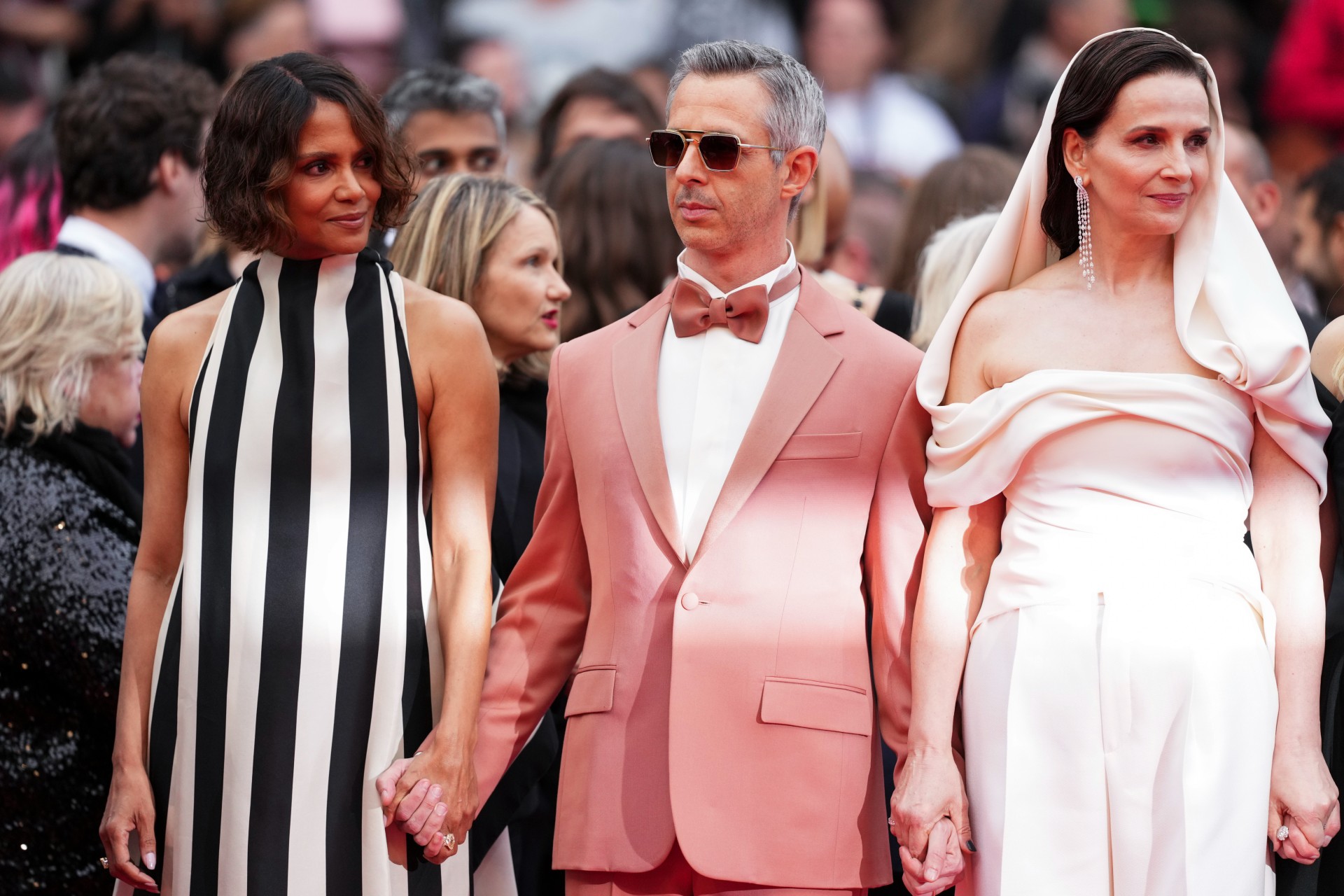Jury president Juliette Binoche, right, and jury members Halle Berry, and Jeremy Strong pose for photographers during the opening ceremony of the 78th international film festival, Cannes, southern France, Tuesday, May 13, 2025. (Photo by Scott A Garfitt/Invision/AP) France Cannes 2025 Opening Ceremony