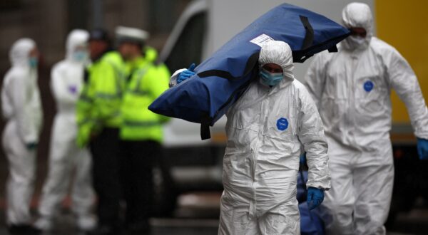 epa12138664 A forensics officer carries a tent on to the scene where a car collided with people during the Liverpool FC trophy parade in Liverpool city centre, Britain, 27 May 2025. A 53-year-old British man has been detained after the collision with a number of pedestrians during Liverpool FC’s victory parade, Merseyside Police said.  EPA/ADAM VAUGHAN