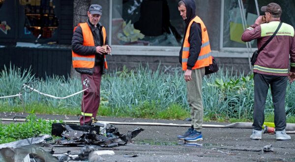 Utility workers look at the wreckage of a downed Russian drone after the attack on the Shevchenkivskyi district of Kyiv, Ukraine, on May 7, 2025 (Photo by Danylo Antoniuk/Ukrinform)
  (Photo by Ukrinform/Ukrinform/Sipa USA) Photo: UKRINFORM/SIPA USA