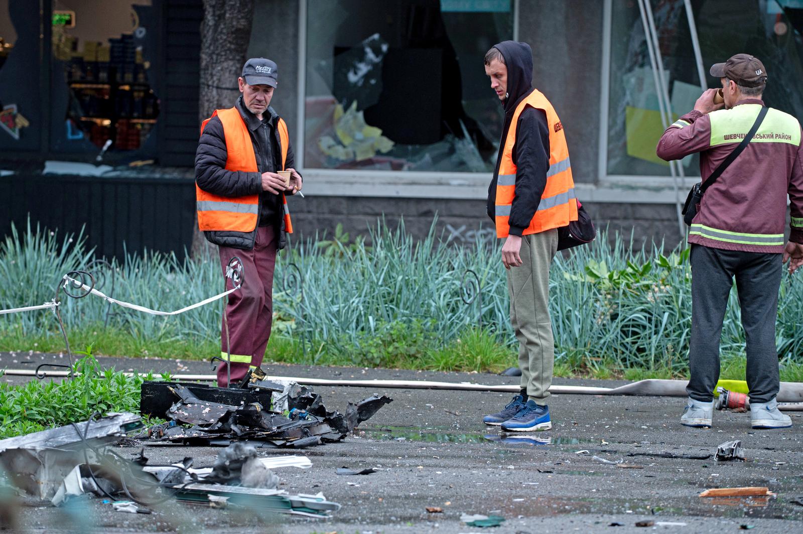 Utility workers look at the wreckage of a downed Russian drone after the attack on the Shevchenkivskyi district of Kyiv, Ukraine, on May 7, 2025 (Photo by Danylo Antoniuk/Ukrinform)
  (Photo by Ukrinform/Ukrinform/Sipa USA) Photo: UKRINFORM/SIPA USA