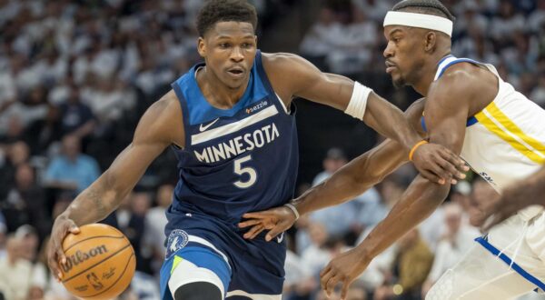 May 8, 2025; Minneapolis, Minnesota, USA; Minnesota Timberwolves guard Anthony Edwards (5) dribbles the ball past Golden State Warriors forward Jimmy Butler III (10) in the first half during game two of the second round for the 2025 NBA Playoffs at Target Center. Mandatory Credit: Jesse Johnson-Imagn Images/Sipa USA Photo: Imagn Images/SIPA USA