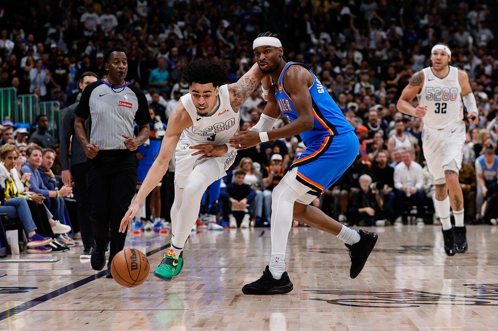 May 15, 2025; Denver, Colorado, USA; Denver Nuggets guard Julian Strawther (3) controls the ball as Oklahoma City Thunder guard Shai Gilgeous-Alexander (2) guards in the fourth quarter during game six of the second round for the 2025 NBA Playoffs at Ball Arena. Mandatory Credit: Isaiah J. Downing-Imagn Images/Sipa USA Photo: Imagn Images/SIPA USA