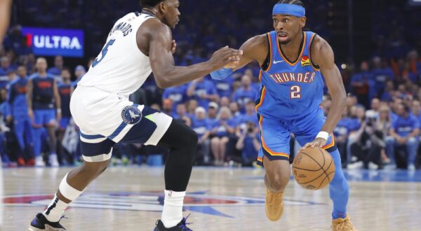 May 22, 2025; Oklahoma City, Oklahoma, USA; Oklahoma City Thunder guard Shai Gilgeous-Alexander (2) drives against Minnesota Timberwolves guard Anthony Edwards (5) in the first quarter during game two of the western conference finals for the 2025 NBA Playoffs at Paycom Center. Mandatory Credit: Alonzo Adams-Imagn Images/Sipa USA Photo: Imagn Images/SIPA USA