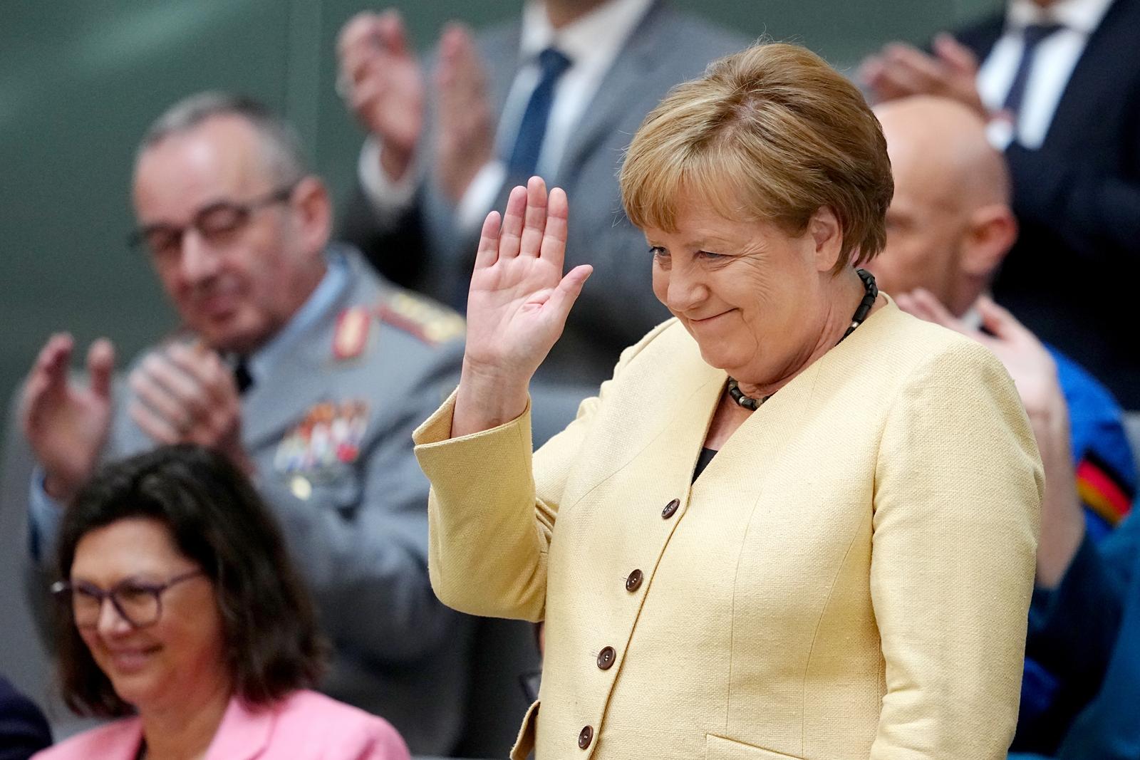06 May 2025, Berlin: Angela Merkel (CDU), former Federal Chancellor, waves in the gallery before the election of the Chancellor in the Bundestag. The election and swearing-in of the Federal Chancellor and the new Federal Government takes place in the Bundestag. Photo: Kay Nietfeld/dpa Photo: Kay Nietfeld/DPA