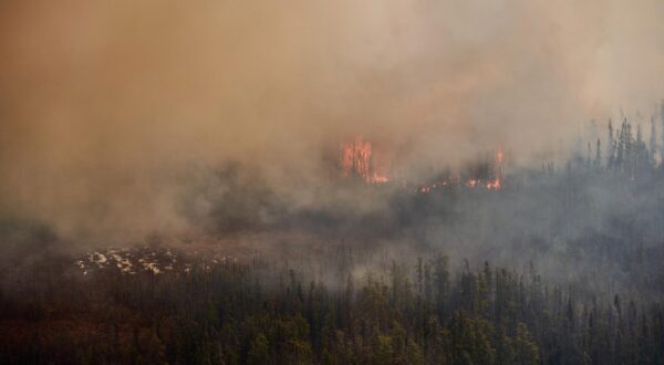 A wildfire burns in northern Manitoba near near Flin Flon, as seen from a helicopter surveying the situation, May 14, 2024. A northern Manitoba First Nation is being evacuated as a nearby wildfire threatens to edge closer to the community because of wind. THE CANADIAN PRESS/David Lipnowski Photo: DAVID LIPNOWSKI/PRESS ASSOCIATION