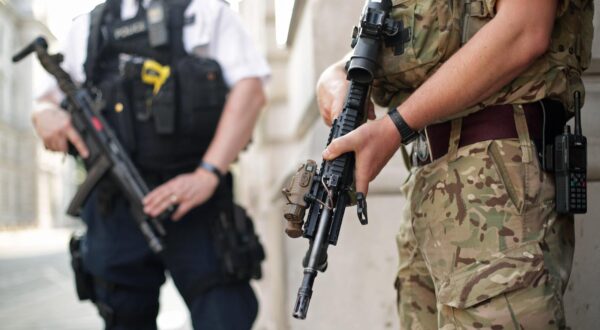 Manchester Arena incident A police officer and a soldier on duty outside the Foreign and Commonwealth Office, London, as armed troops have been deployed to guard "key locations" under Operation Temperer, which is being enacted after security experts warned the Government that another terrorist attack could be imminent. Yui Mok  Photo: Press Association/PIXSELL