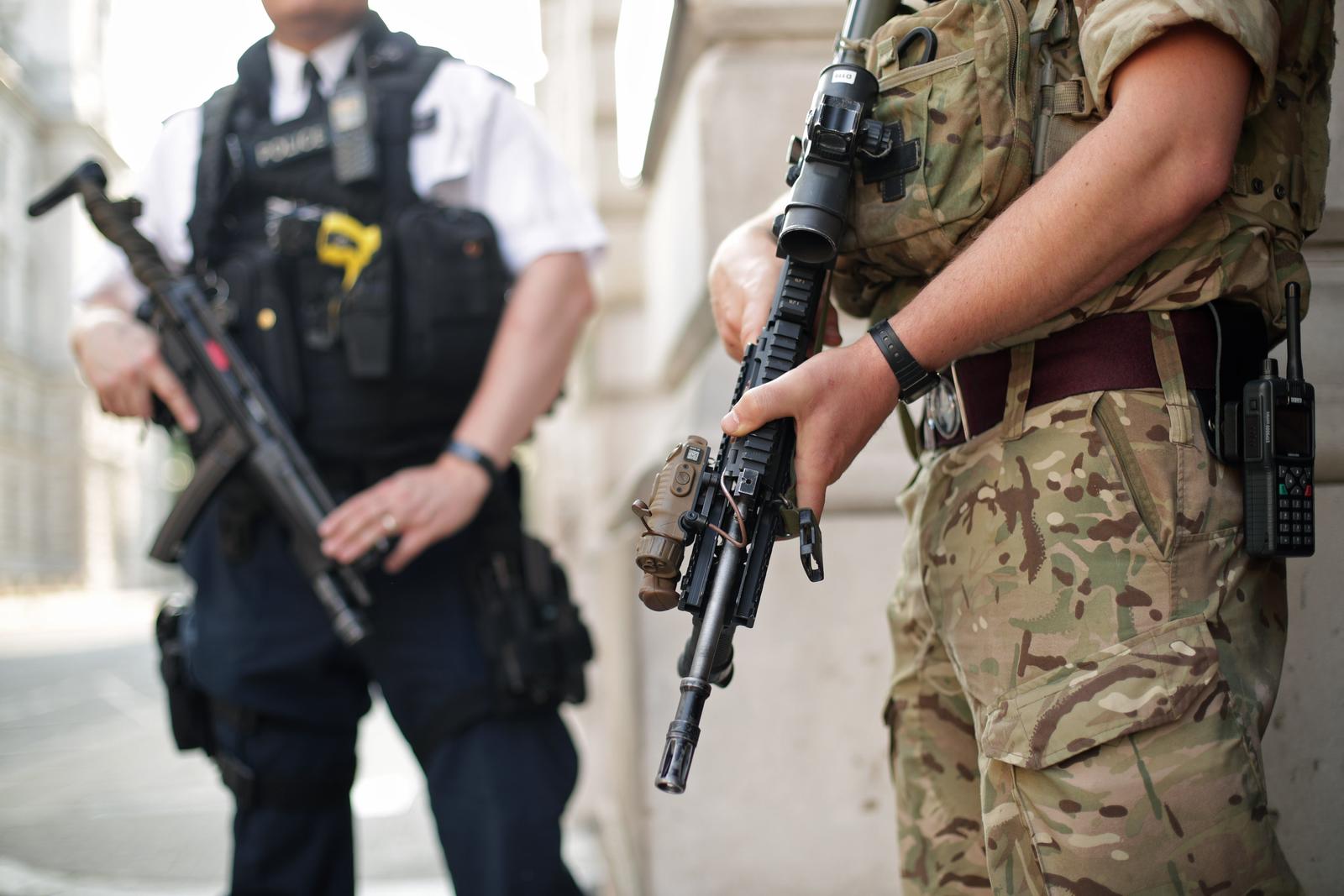 Manchester Arena incident A police officer and a soldier on duty outside the Foreign and Commonwealth Office, London, as armed troops have been deployed to guard "key locations" under Operation Temperer, which is being enacted after security experts warned the Government that another terrorist attack could be imminent. Yui Mok  Photo: Press Association/PIXSELL