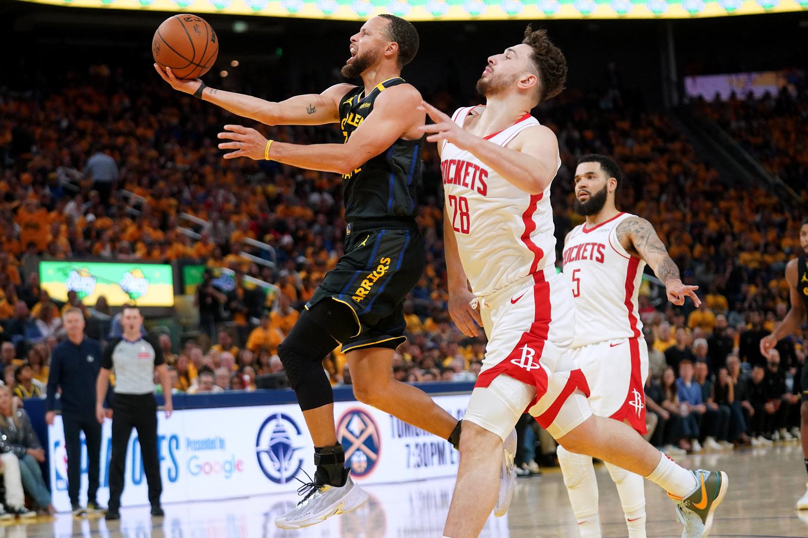 May 2, 2025; San Francisco, California, USA; Golden State Warriors guard Stephen Curry (30) drives to the hoop in front of Houston Rockets center Alperen Sengun (28) in the third quarter of game six of the first round for the 2025 NBA Playoffs at Chase Center. Mandatory Credit: Cary Edmondson-Imagn Images Photo: Cary Edmondson/REUTERS