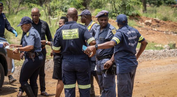 (250114) -- STILFONTEIN (SOUTH AFRICA), Jan. 14, 2025 (Xinhua) -- Police officers and forensic pathology service members work during a rescue operation at an abandoned gold mine in Stilfontein, North West Province, South Africa, on Jan. 13, 2025. A total of 118 illegal miners were brought to the surface during rescue operations at the abandoned gold mine on Monday and Tuesday in Stilfontein, with 36 confirmed dead, according to the police. (Photo by Shiraaz Mohamed/Xinhua) Photo: Shiraaz Mohamed/XINHUA