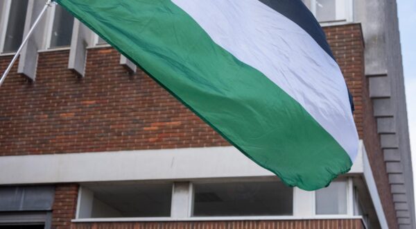 A Palestinian flag flies during a demonstration outside the Margate Magistrates and County Court. Pro-Palestine protesters gathered outside the Margate Magistrates' Court because eight members of the Palestine Action are on trial. The reason is the actionists recently shut down every entrance of the Elbit Systems' Instro Precision weapons factory in Sandwich, Kent to stop the production of Israeli weapons used in deadly attacks on Palestinians. (Photo by Krisztian Elek / SOPA Images/Sipa USA) Photo: SOPA Images/SIPA USA