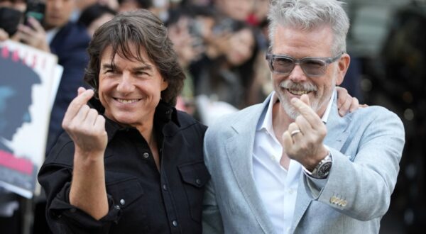 Actor Tom Cruise, left, and director Christopher McQuarrie pose for the photographers upon their arrival to promote their latest movie "Mission: Impossible - The Final Reckoning," at the Gimpo Airport in Seoul, South Korea, Wednesday, May 7, 2025. (AP Photo/Lee Jin-man) APTOPIX South Korea Film Mission Impossible The Final Reckoning