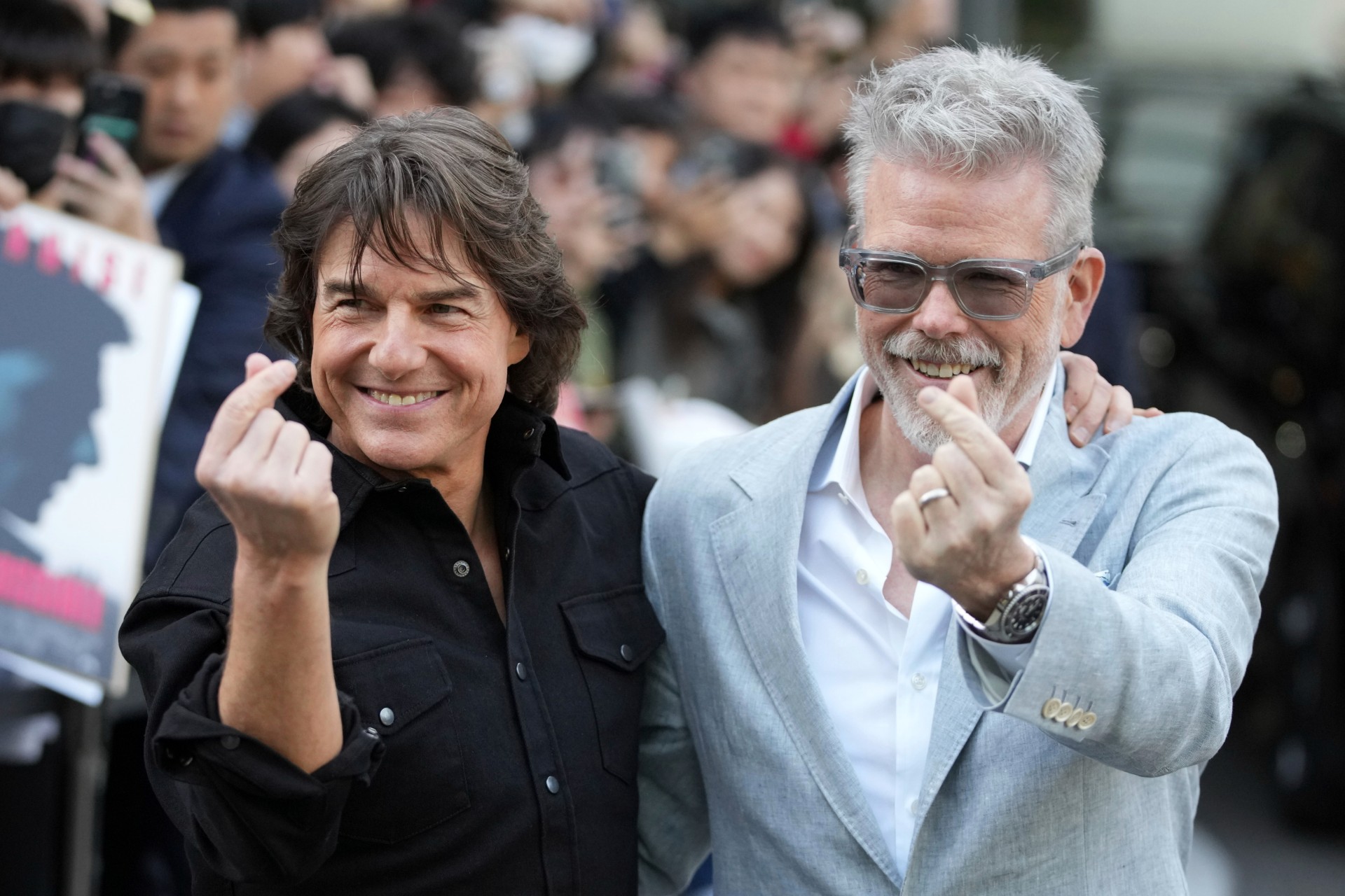 Actor Tom Cruise, left, and director Christopher McQuarrie pose for the photographers upon their arrival to promote their latest movie "Mission: Impossible - The Final Reckoning," at the Gimpo Airport in Seoul, South Korea, Wednesday, May 7, 2025. (AP Photo/Lee Jin-man) APTOPIX South Korea Film Mission Impossible The Final Reckoning
