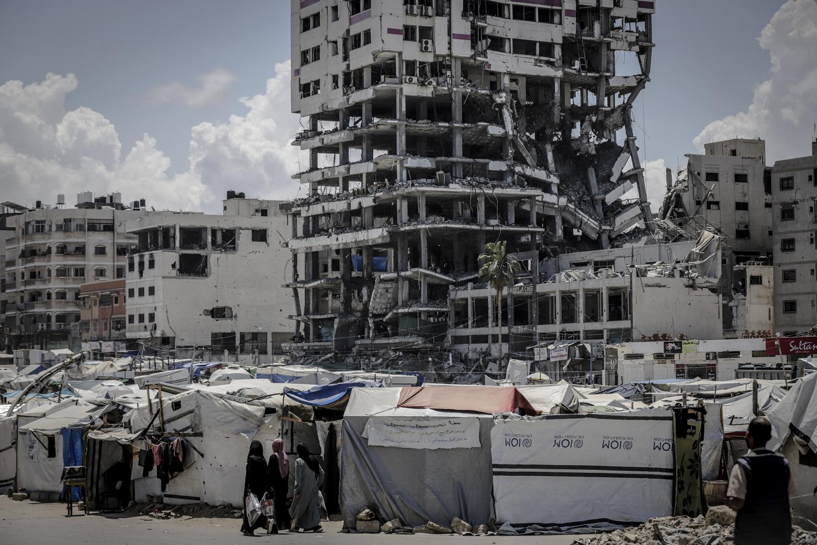 Tents stand beneath a destroyed building in the Al-Rimal neighborhood of Gaza City, Palestine, on May 4, 2025. The daily life of Palestinians continues beside the temporary tents set up in the area, amid the difficult living conditions endured by the population in central Gaza. Photo by Saeed Jaras/Middle East Images/ABACAORESS.COM Photo: Middle East Images/ABACA/ABACA