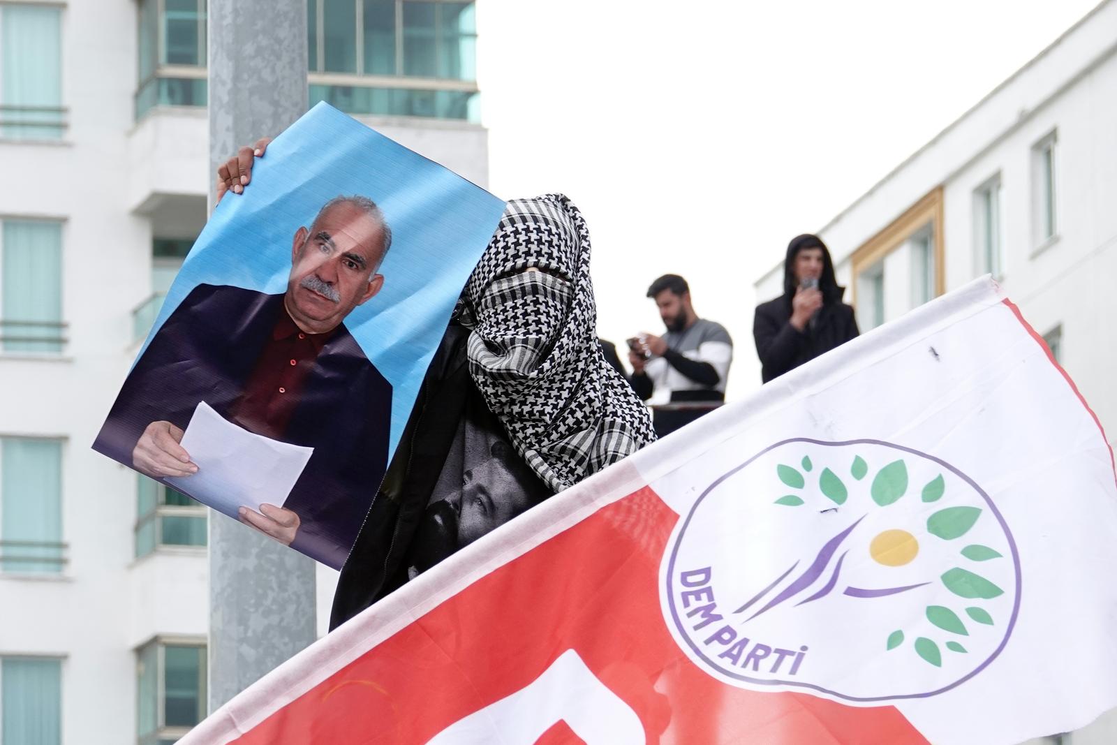 A young demonstrator is seen carrying a poster of PKK leader Abdullah Ocalan at the Newroz celebration in Diyarbakir. At the Newroz celebration, which was celebrated on March 21 in the city of Diyarbakir in Turkey and attended by hundreds of thousands of people, a large number of demonstrators carried posters of Abdullah Ocalan, the leader of the Kurdish armed organization Kurdistan Workers' Party (PKK). Abdullah Ocalan, who has been held in prison for 25 years, had asked the PKK, an organization that has been in conflict with the Turkish army for 40 years, to lay down its weapons and dissolve itself. The peace negotiations between the PKK and the Turkish state are continuing. (Photo by Mehmet Masum Suer / SOPA Images/Sipa USA) Photo: SOPA Images/SIPA USA