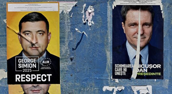 epa12102854 A billboard displays electoral posters of the candidates for the 2025 presidential election runoff, in Bucharest, Romania, 15 May 2025. The runoff for the 2025 Romanian presidential election will be held on 18 May between AUR party leader George Simion, who won the first round of the Romanian election rerun with 40.96 percent of the vote, and mayor of Bucharest Nicusor Dan.  EPA/ROBERT GHEMENT