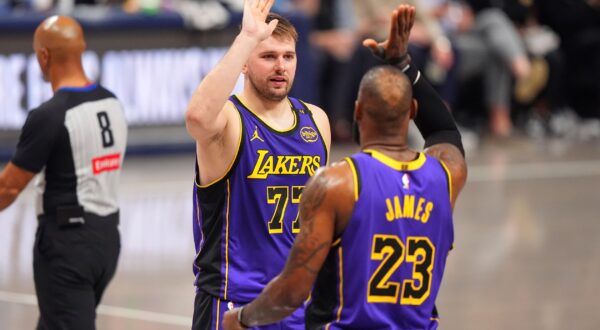 Los Angeles Lakers' Luka Doncic (77) and LeBron James (23) celebrate in the second half of an NBA basketball game against the Dallas Mavericks in Dallas, Wednesday, April 9, 2025. (AP Photo/LM Otero) Lakers Mavericks Basketball