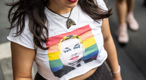 11 May 2024, Hungary, Budapest: The face of Prime Minister Viktor Orban can be seen on the T-shirt of a participant in the Trans Pride march. Photo: Marton Monus/dpa Photo: MARTON MONUS/DPA