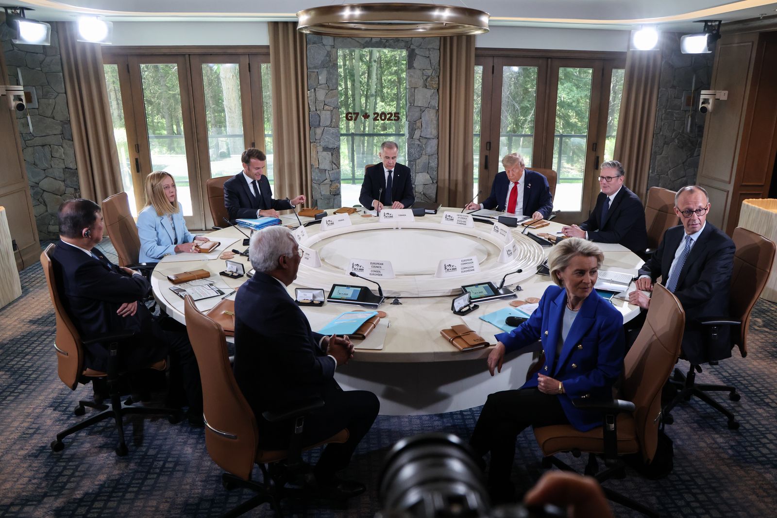 epa12179446 (L-R, clockwise) Japan's Prime Minister Shigeru Ishiba, Italy's Prime Minister Giorgia Meloni, French President Emmanuel Macron, Canadian Prime Minister Mark Carney, US President Donald Trump, British Prime Minister Keir Starmer, German Chancellor Friedrich Merz, European Commission President Ursula Von der Leyen, and European Council President Antonio Costa attend a working session at the Group of Seven (G7) Summit at the Pomeroy Kananaskis Mountain Lodge, in Kananaskis, Alberta, Canada, 16 June 2025.  EPA/LUDOVIC MARIN / POOL