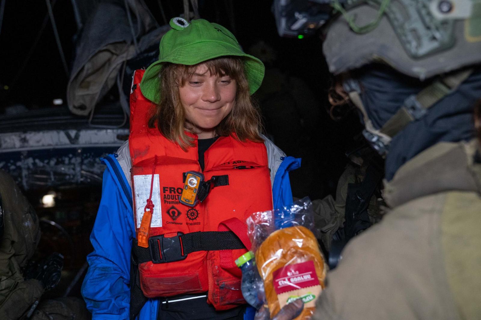 Greta Thunberg is all smiles in the early morning of Monday, June 9, 2025, after the Israeli Defense Forces boarded the "Madleen," a small civilian maritime vessel previously bound for Gaza with humanitarian aid, and rerouted those on board toward Israel, the foreign ministry said. The "Madleen" is part of the Freedom Flotilla Coalition carrying aid to the region that set sail from Sicily on June 1. Photo via Israel Foreign Ministry/UPI Photo via Newscom Photo: ISRAEL MFA/NEWSCOM