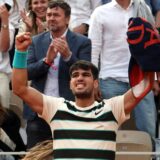 epa12164393 Carlos Alcaraz of Spain celebrates after winning the fourth set during his Men's final match against Jannik Sinner of Italy at the French Open Grand Slam tennis tournament at Roland Garros in Paris, France, 08 June 2025.  EPA/MOHAMMED BADRA