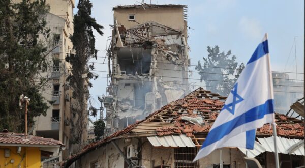 epa12176678 Israeli rescue teams work at the site of a damaged residential area after Iranian ballistic missiles hit Rehovot, central Israel, 15 June 2025. Iran launched a barrage of ballistic missiles at Israel overnight in retaliation for Israeli airstrikes on Iranian targets. Magen David Adom (MDA), Israel's national emergency services, reported at least six killed and dozens injured, including two in critical condition.  EPA/ABIR SULTAN