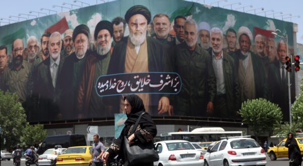 epa12152295 A huge billboard carrying picture of Iranian late supreme leader Ayatollah Ruhollah Khomeini (C) along with Iranians, Lebanese and Hamas late leaders, and a sentence reading in Persian 'The spirit of God has been breathed into the noblest of creatures' is seen on the occasion of 36th anniversary of Ayatollah Khomeini's death, in Tehran, Iran, 03 June 2025. Iran will celebrate 36th anniversary of Ayatollah Khomeini's death on 04 June 2025.  EPA/ABEDIN TAHERKENAREH