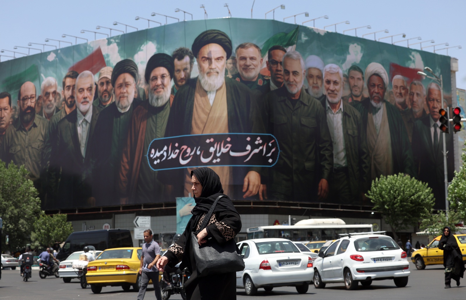 epa12152295 A huge billboard carrying picture of Iranian late supreme leader Ayatollah Ruhollah Khomeini (C) along with Iranians, Lebanese and Hamas late leaders, and a sentence reading in Persian 'The spirit of God has been breathed into the noblest of creatures' is seen on the occasion of 36th anniversary of Ayatollah Khomeini's death, in Tehran, Iran, 03 June 2025. Iran will celebrate 36th anniversary of Ayatollah Khomeini's death on 04 June 2025.  EPA/ABEDIN TAHERKENAREH