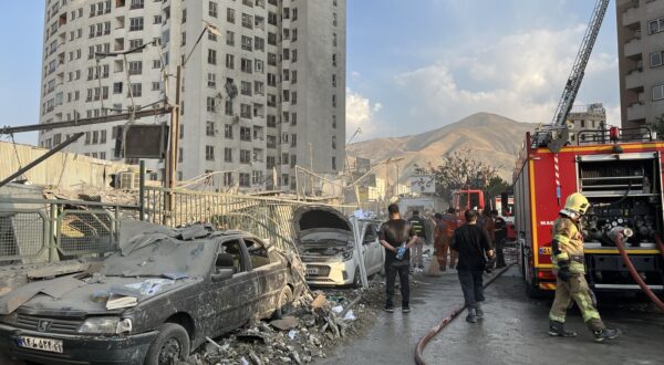 epaselect epa12172720 Fire fighters work outside a building that was hit by Israeli air strikes north of Tehran, Iran, 13 June 2025. Israel confirms it has launched strikes on Iran's 'nuclear program' as blasts are heard across the country. The strikes are part of Operation Rising Lion, Israel's Prime Minister Benjamin Netanyahu said, adding Iran was a threat to "Israel's very survival".  EPA/ABEDIN TAHERKENAREH