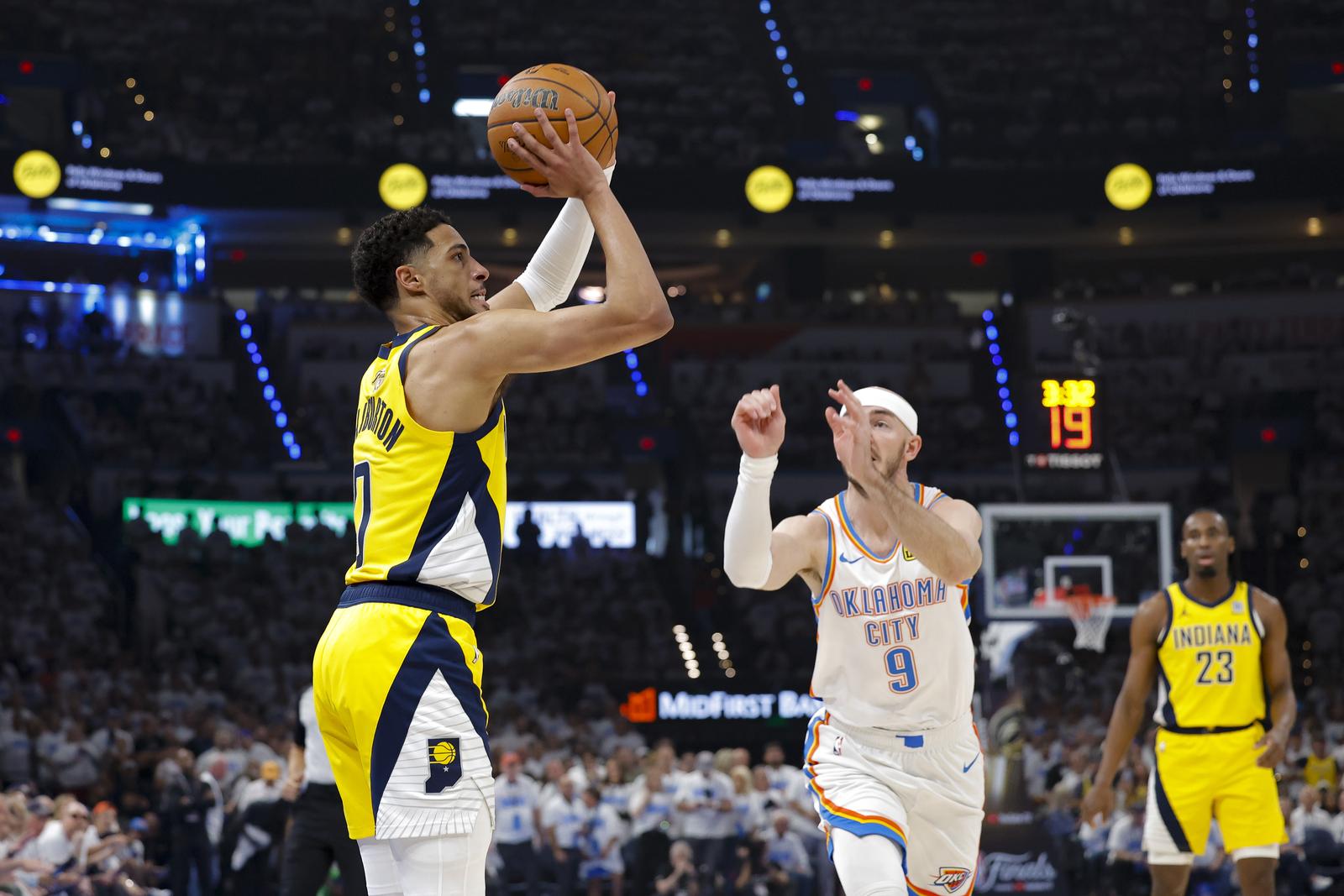 Jun 5, 2025; Oklahoma City, Oklahoma, USA; Indiana Pacers guard Tyrese Haliburton (0) shoots the ball over Oklahoma City Thunder guard Alex Caruso (9) during the first quarter during game one of the 2025 NBA Finals at Paycom Center. Mandatory Credit: Alonzo Adams-Imagn Images/Sipa USA Photo: Imagn Images/SIPA USA
