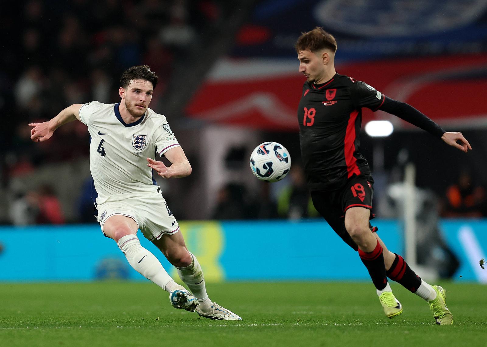 London, England, 21st March 2025. Declan Rice of England and Adrion Pajaziti of Albania challenge for the ball during the FIFA World Cup, WM, Weltmeisterschaft, Fussball European Qualifying match at Wembley Stadium, London. Picture credit should read: Paul Terry / Sportimage EDITORIAL USE ONLY. No use with unauthorised audio, video, data, fixture lists, club/league logos or live services. Online in-match use limited to 120 images, no video emulation. No use in betting, games or single club/league/player publications. SPI_170_PT_England_Albania SPI-3761-0152 Photo: IMAGO/Paul Terry/IMAGOSPORT