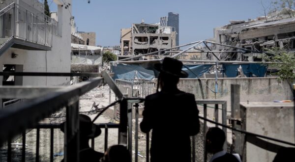 Israelis inspect the ruins in the scene in Bnei Brak, on June 17, 2025, where an Iranian ballistic missile landed yesterday. Many residents were forced to leave their damaged houses, which were in danger of collapsing amid the Israel-Iran conflicts. Photo by Dima Vazinovich/Middle East Images/ABACAPRESS.COM Photo: Middle East Images/ABACA/ABACA