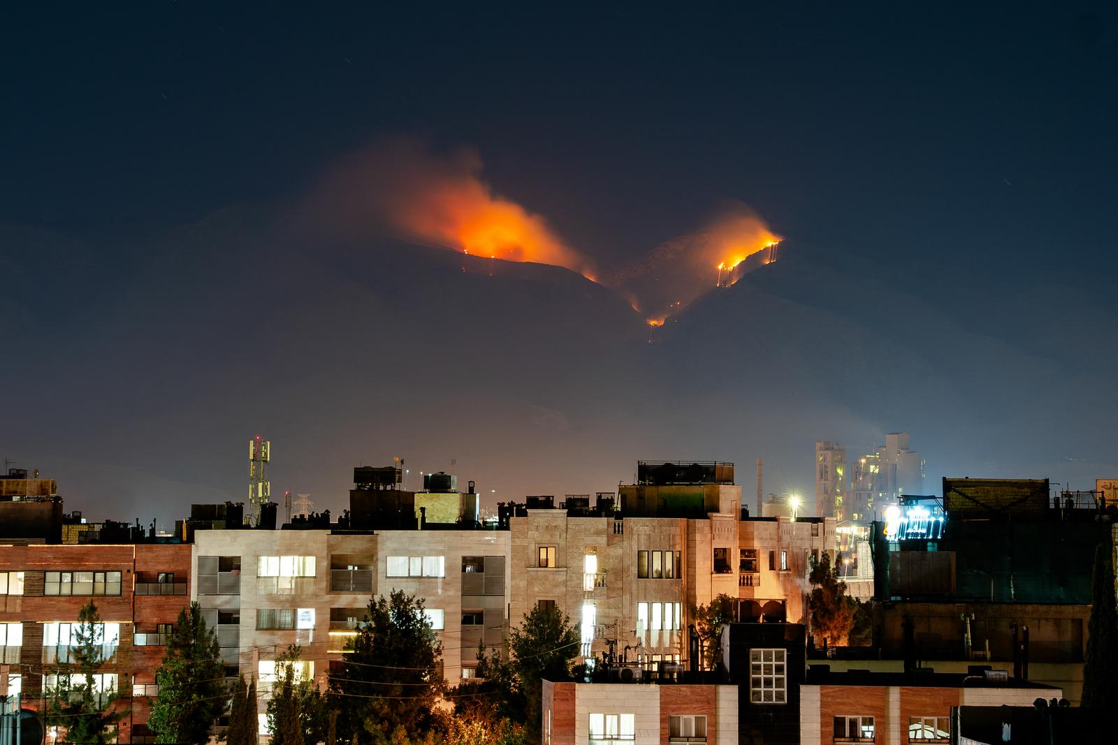 Smoke rises as fire burns, in an alleged site of IRGC's missile launch targeted by Israel on the mountains of Shiraz, Iran on June 21, 2025. Israel attacked Iran in early hours of June 13, and the exchange of fire between the two countries continues ever since. Photo by Hiroon/Middle East Images/ABACAPRESS.COM Photo: Middle East Images/ABACA/ABACA